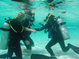 PADI open water diver course students practicing in the pool